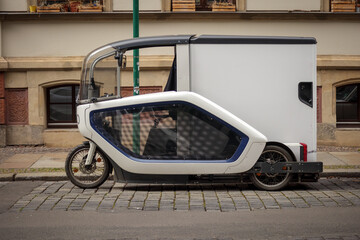 Leipzig, Saxony, Germany 03-18-2022 a modern e-cargo bike from a parcel service with a driver's...