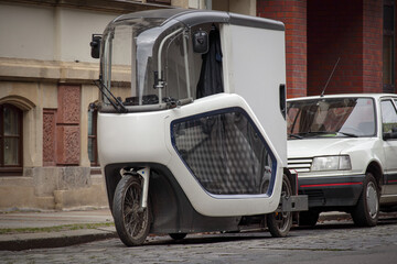 Obraz na płótnie Canvas Leipzig, Saxony, Germany 03-18-2022 a modern e-cargo bike from a parcel service with a driver's cabin