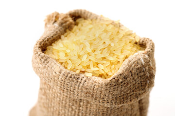 Polished steamed rice in bowls and bags isolated on a white background. High quality photo