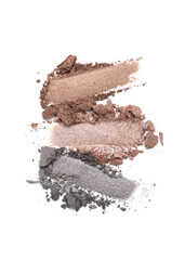 Close-up of make-up swatches. Smears of crushed grey and brown eye shadow
