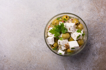 Bowl of delicious olives with Feta cheese in oil