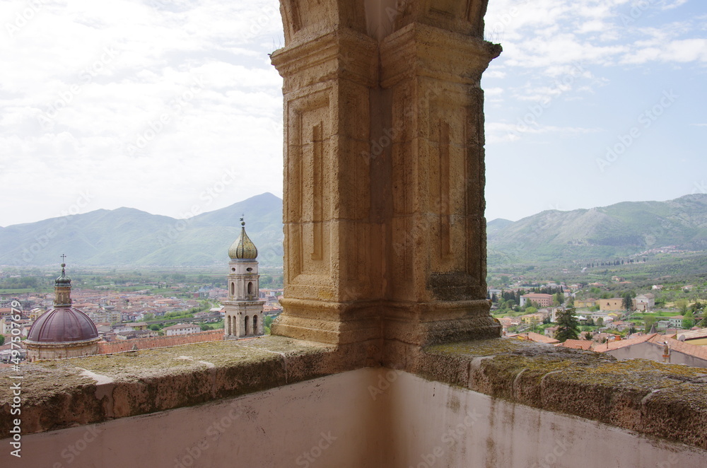 Wall mural in the foreground a column of the pandone castle and in the background you can see the annunziata di