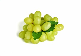 Close up of green grapes with grape leaves isolated on white background.