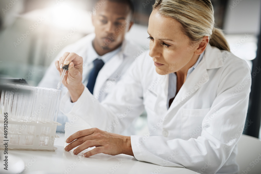 Aufkleber Lets test these samples. Cropped shot of two scientists testing a sample while doing research in their lab.