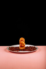 pancakes with honey on a black background