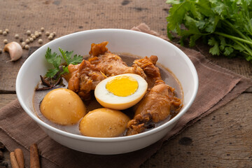 Egg and drummet chicken in Sweet Brown Sauce ,Kai Pa Lo in white bowl