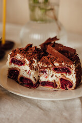 Traditional Ukrainian Easter cake. Traditional dessert. Easter cake stands on a festive table decorated with sweets. Holy Easter