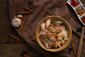 Noodles with pork and meatball in red soup (Look Chin Moo Nam Daeng).Thai street food.Top view
