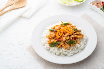 Rice topped with stir-fried minced chicken and basil (Gai Pad Grapow).Thai food