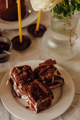 Traditional Ukrainian Easter cake. Traditional dessert. Easter cake stands on a festive table decorated with sweets. Holy Easter