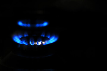 fire in a gas stove close-up. saving gas at home