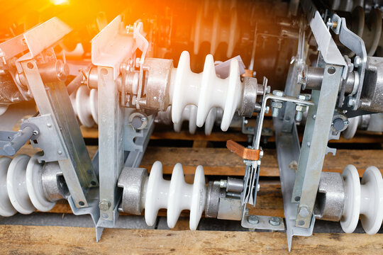 New ceramic insulator for high-voltage poles is on shelves of warehouse. Equipment for electricity. Advertising background.