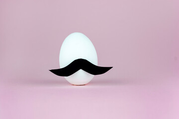 Easter egg with hipster mustache. Minimal concept.
