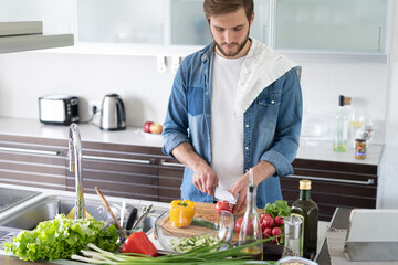 Portrait of man cooking food cutting prepare hands knife preparing vegetables.