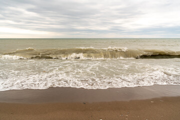 Waves rolling onto the shore of Lake Ontario in spring.  Shot in Toronto's iconic Beaches neighbourhood. Room for text	
