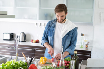 Portrait of man cooking food cutting prepare hands knife preparing vegetables.