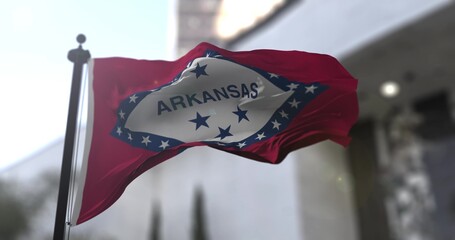 Arkansas state waving flag on blurry background, USA state news illustration. Blurry background - obrazy, fototapety, plakaty