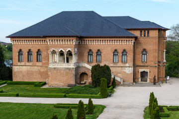 Old historical buiding at Mogosoaia Palace (Palatul Mogosoaia) near the lake and park, a weekend attraction close to Bucharest, Romania, in a sunny spring day.