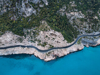 Aerial view of Aurelia street in Noli, Capo Noli and Varigotti, province of Savona. Drone photography from above of snake street snake in Liguria, north Italy, near Bergeggi and Spotorno.