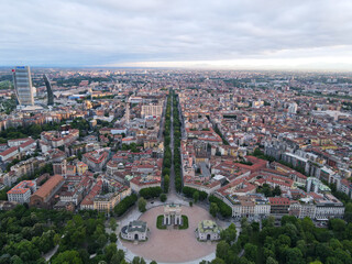 Obraz premium Aerial view of Arco della Pace in Milano, north Italy. Drone photography of Arch of Peace in Piazza Sempione, near Sempione park in the heart of Milan, Lombardy and Sforza Castle.