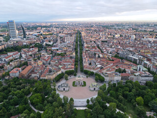 Aerial view of Arco della Pace in Milano, north Italy. Drone photography of Arch of Peace in Piazza Sempione, near Sempione park in the heart of Milan, Lombardy and Sforza Castle.