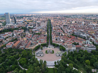 Aerial view of Arco della Pace in Milano, north Italy. Drone photography of Arch of Peace in Piazza Sempione, near Sempione park in the heart of Milan, Lombardy and Sforza Castle.