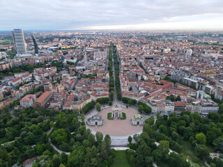 Fototapeta premium Aerial view of Arco della Pace in Milano, north Italy. Drone photography of Arch of Peace in Piazza Sempione, near Sempione park in the heart of Milan, Lombardy and Sforza Castle.
