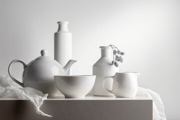 Fototapeta na wymiar White still life with white dishes on a white background