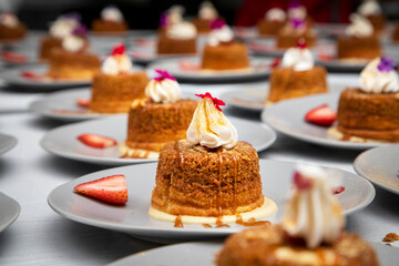 Rows of cake desert with whipped cream