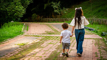 boy and girl walking at the park