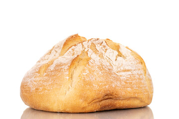 One loaf of fresh fragrant white wheat bread, macro, isolated on a white background.