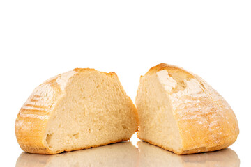 Two halves of a loaf of fresh fragrant white wheat bread, macro, isolated on a white background.