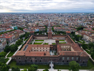 Aerial view of Castello Sforzesco (Sforza castle) in Milan. Drone photography in Lombardia. Historic medieval Sforza fortress and Arco della Pace in Sempione park, north Italy, in Europe.