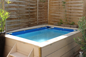 Closeup of a small wooden-framed children's pool