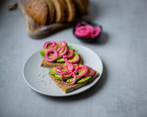 Fototapeta na wymiar Red Onion Pickles Bread with Avocado