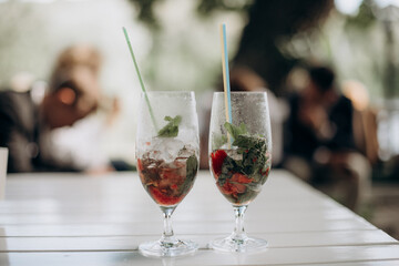 glasses with unfinished alcoholic drink at a party
