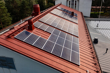 Photovoltaic cells on a red house rooftop 01