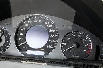 The dashboard of the car with white arrows with a speedometer, tachometer and other tools to...