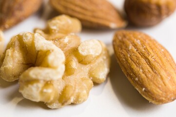 Isolated walnuts and almonds in macro view