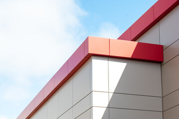 The exterior wall of a contemporary commercial style building with aluminum metal composite panels...