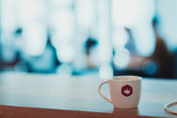 Blurred photo of young multi-ethnic business people working and communicating together in creative office. Selective focus 