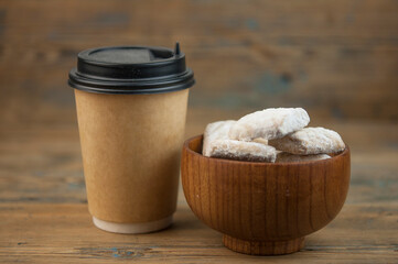 short pastry cookies in wood bowl, sprinkled with powdered sugar. ready-made shortbread.