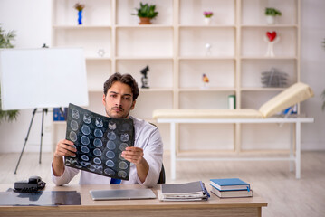 Young male doctor radiologist working in the clinic