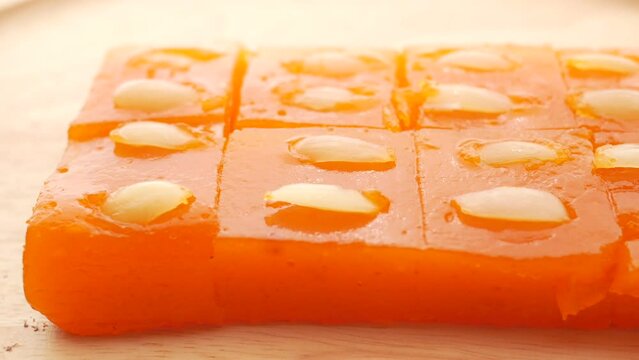 close up of indian sweet on a wooden plate 