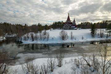 Beautiful view of a building surrounded by trees in winter