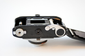 Old retro photo camera isolated on a white background