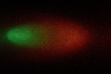 On a black background, a gradient red and green beam of light