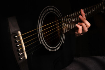 Obraz na płótnie Canvas professional musician playing guitar close-up of hands