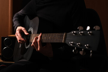 professional musician playing guitar close-up of hands