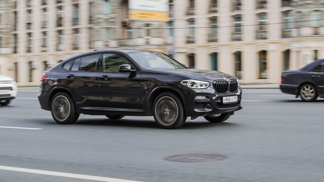 BMW X4 xDrive20d M Sport car on the street in motion